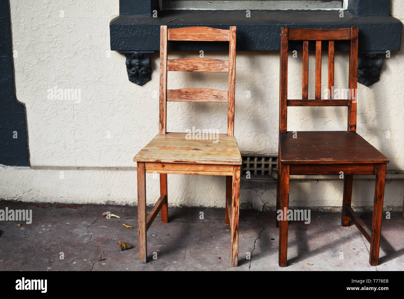 Social distancing Two old wooden chairs Stock Photo