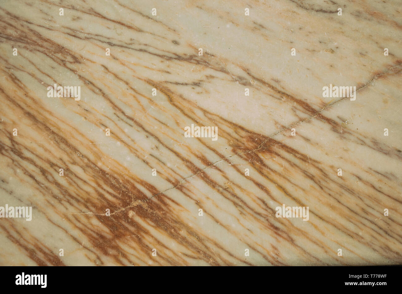 Close-up of old marble surface with veins and some cracks and chipped at Campo Maior. A town with medieval influences in eastern Portugal. Stock Photo