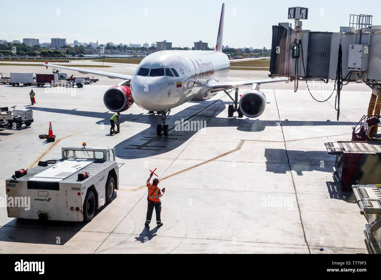 Miami Florida,International Airport MIA,Avianca Airlines,arriving jet airliner tarmac,aircraft marshaller,service area,commercial airliner airplane pl Stock Photo