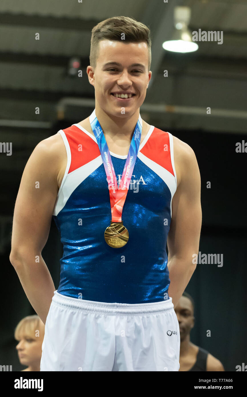 Telford, England, UK. 28 April, 2018. Ben Goodall (OLGA Poole) receives his gold medal during Spring Series 1 at the Telford International Centre, Telford, UK. Stock Photo
