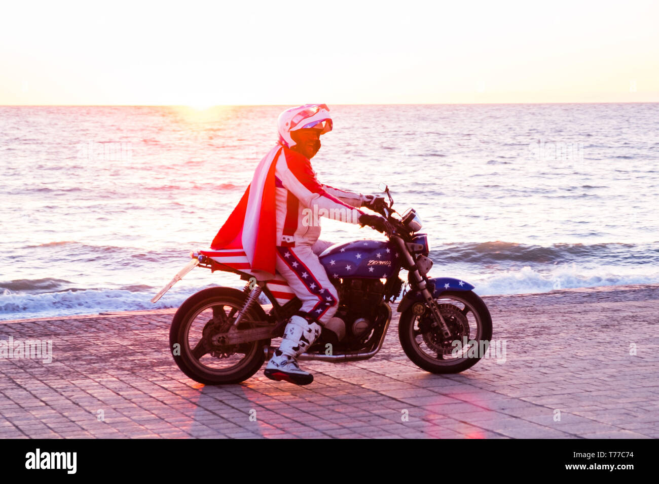 Aberystwyth, Wales. 04th May, 2019.   Some of the 50 motor bikers, all dressed as iconic stunt rider  'Evel Kneivel' arrive in Aberystwyth a dusk  as part of their annual charity fund raising ride around wales.  Now in its 8th year, the bikers start and finish in Wrexham and take 5 days to ride the 1070 mile perimiter of Wales, raising money for Macmillan Cancer Support, ending on Bank Holiday Monday   Credit: keith morris/Alamy Live News Stock Photo