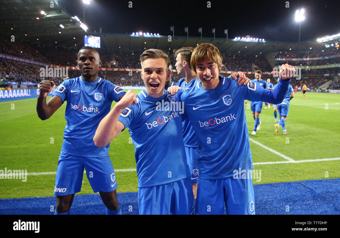 GENK, BELGIUM - MAY 03: Junya Ito of Genk celebrates with Ally Samatta of Genk and Leandro Trossard of Genk after scoring a goal during the Jupiler Pro League play-off 1 match (day 7) between Krc Genk and Royal Antwerp Fc on May 03, 2019 in Genk, Belgium. Stock Photo