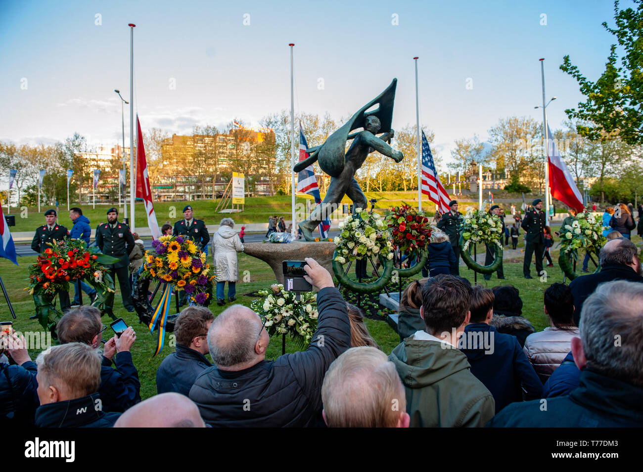 Nijmegen, Gelderland, Netherlands. 4th May, 2019. People seen taking photos of the crowns of flowers left at the monument during the event.Remembrance day celebrations of the victims of WWII in Nijmegen was held with several ceremonies, including: unveiling a plaque with an honorary list of the fallen soldiers of WWII on Plein 1944 square, After that, the commemorations took place at the ''Kitty de Wijze''. Credit: ZUMA Press, Inc./Alamy Live News Stock Photo