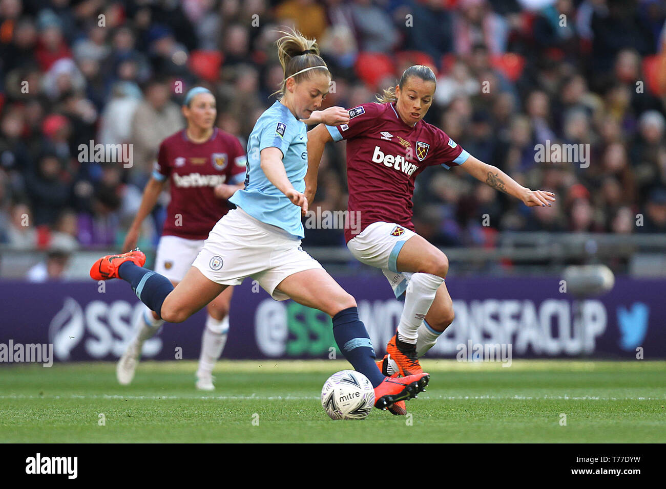 London, UK. 04th May, 2019. Keira Walsh of Manchester City is challenged by Ria Percival of West Ham United during the FA Women's Cup Final match between Manchester City Women and West Ham United Ladies at Wembley Stadium on May 4th 2019 in London, England. Credit: PHC Images/Alamy Live News Stock Photo