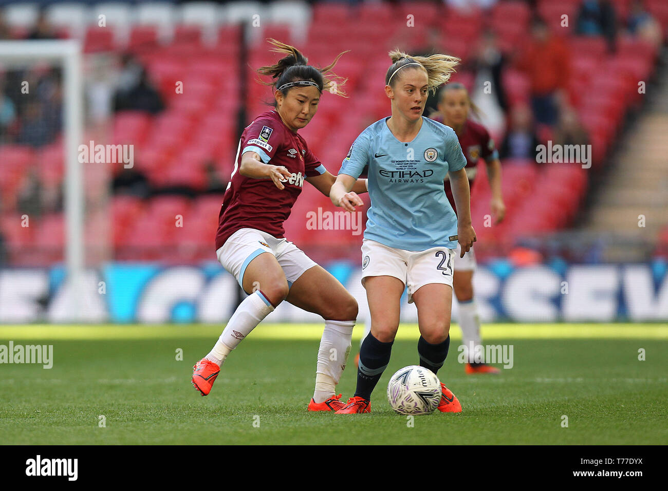 London, UK. 04th May, 2019. Cho So-Hyun of West Ham United and Keira Walsh of Manchester City during the FA Women's Cup Final match between Manchester City Women and West Ham United Ladies at Wembley Stadium on May 4th 2019 in London, England. Credit: PHC Images/Alamy Live News Stock Photo