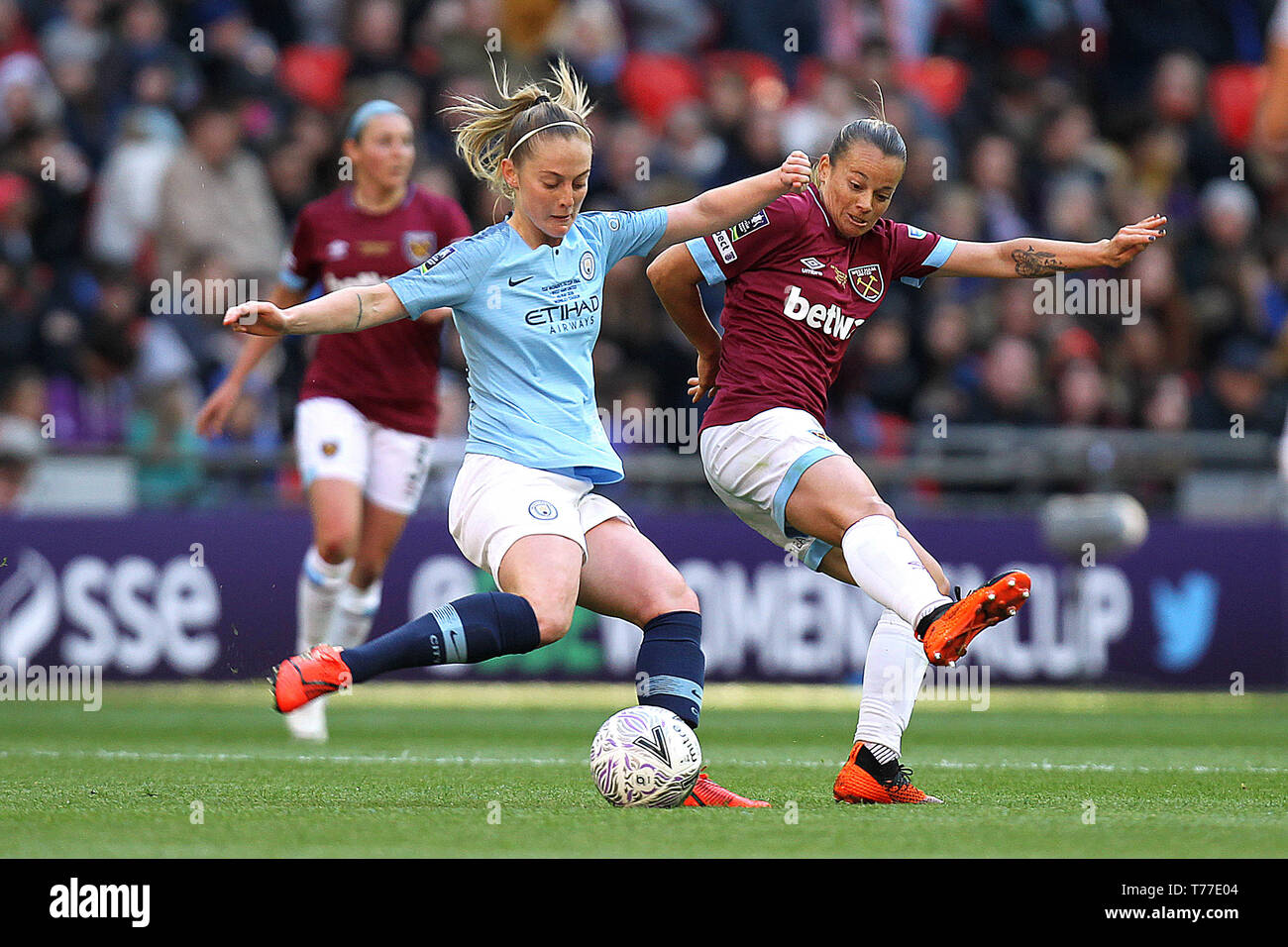 London, UK. 04th May, 2019. Keira Walsh of Manchester City is challenged by Ria Percival of West Ham United during the FA Women's Cup Final match between Manchester City Women and West Ham United Ladies at Wembley Stadium on May 4th 2019 in London, England. Credit: PHC Images/Alamy Live News Stock Photo