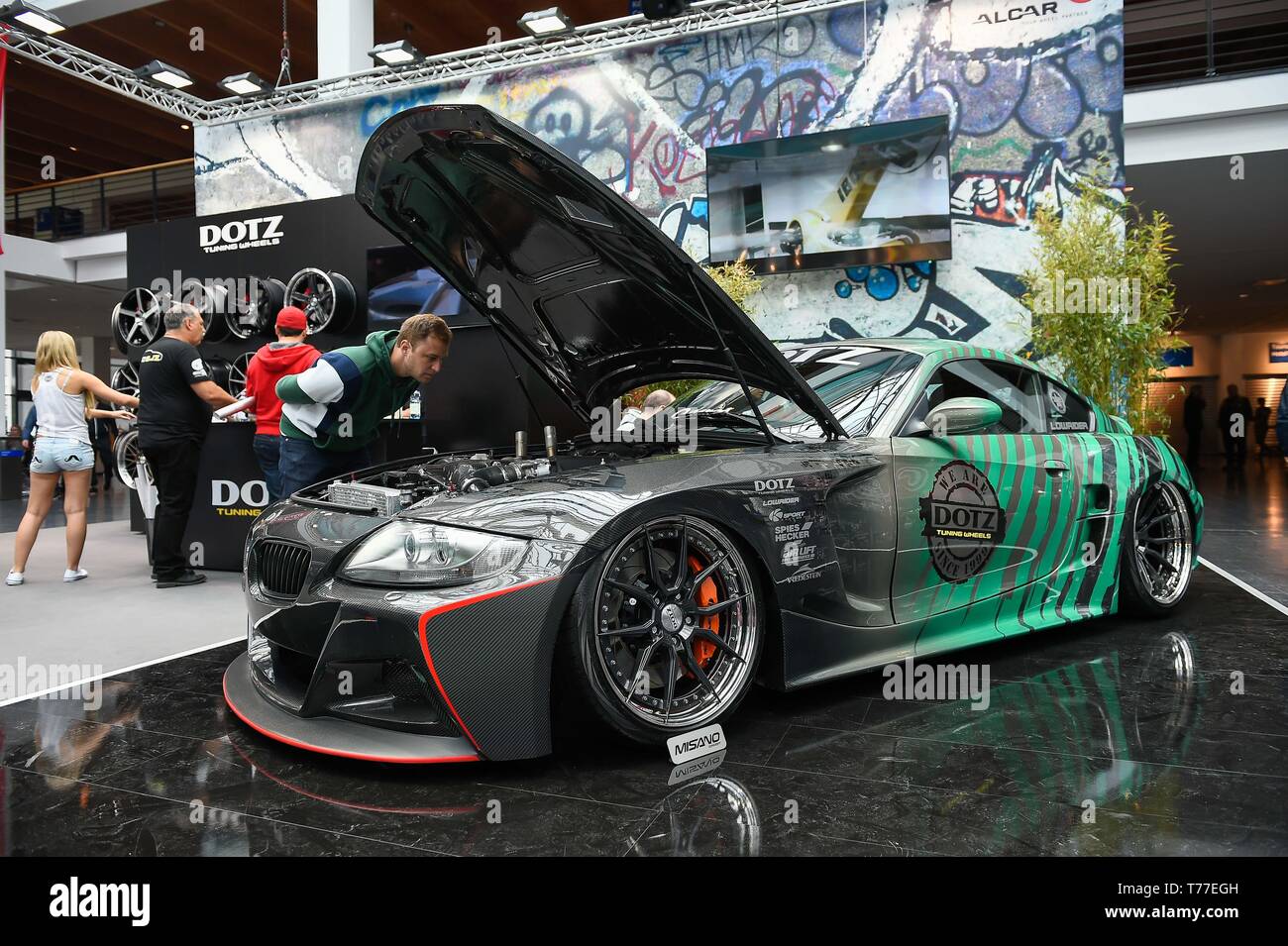 May 4, 2019 - Friedrichshafen, Baden-WÃ¼rttemberg, Germany - A visitor seen  watching a car during Tuning World Bodensee 2019.The biggest Tuning fair,  event, show in Europe with lots of activities and contests.