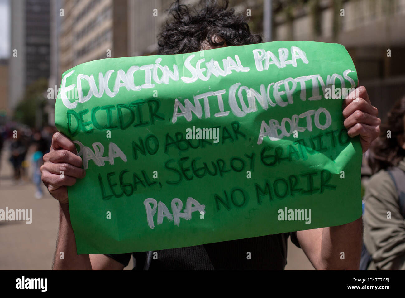 Bogota, Colombia. 04th May, 2019. A member of the feminist pro choice group holding a sign as an act of rebellion against the Pro Life movement during the ''Unidos por la vida'' (United for Life) Pro life rally in Bogota.Under the slogan ''I choose the two lives'' around 500 people demonstrated for the maintenance of traditional family values, against abortion and the killing of social leaders in the country. Catholic and right wing political groups joined the call of the ''United for Life'' Platform (Unidos por la Vida) a widely spread organization in Colombia. Credit: ZUMA Press, Inc./Alamy  Stock Photo