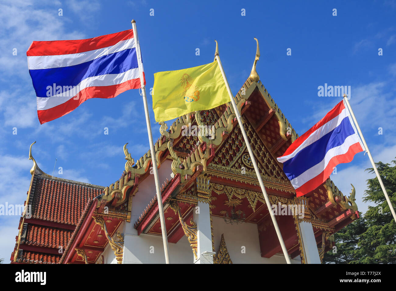 London, UK. 5th May 2019. Thailand national flags and royal colours are flown at the Wat Buddhapadipa Buddhist temple in Wimbledon to celebrate the coronation of  66 year old King Rama X Maha Vajiralongkorn of Thailand Credit: amer ghazzal/Alamy Live News Stock Photo