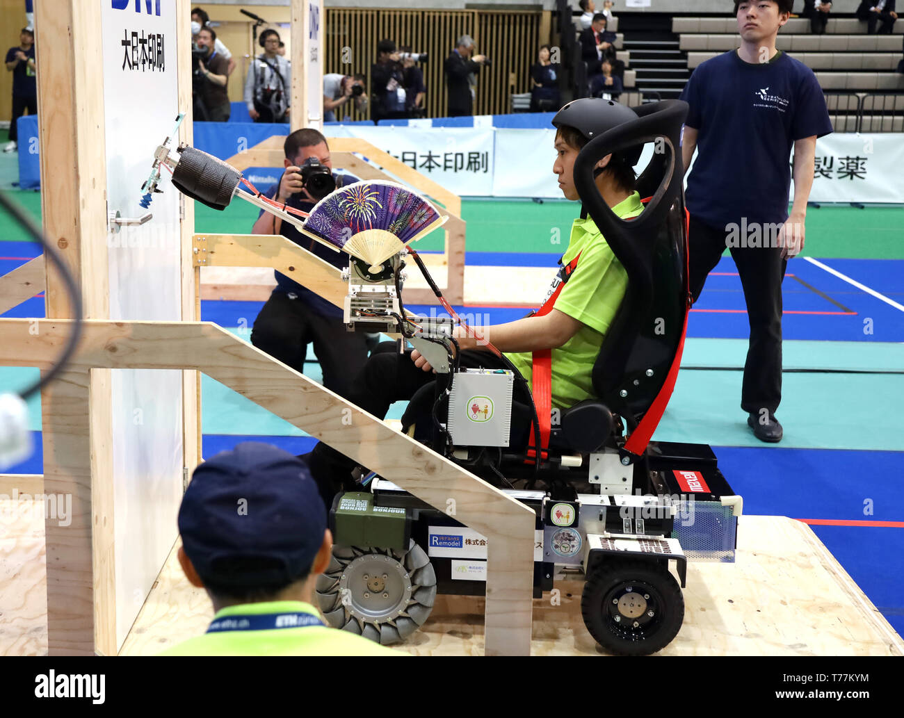 Kawasaki, Japan. 5th May, 2019. Japanese pilot Toshiki Ogura of Osaka Electro-Communication University team on a special electric powered wheelchair uses a robot arm to open a door to clear a task for the Cybathlon Powered Wheelchair Race in Kawasaki, suburban Tokyo on Sunday, May 5, 2019. Eight teams from Russia, Switzerland, Hong Kong and Japan competed a smart wheelchair race with walking disability pilots. Credit: Yoshio Tsunoda/AFLO/Alamy Live News Stock Photo