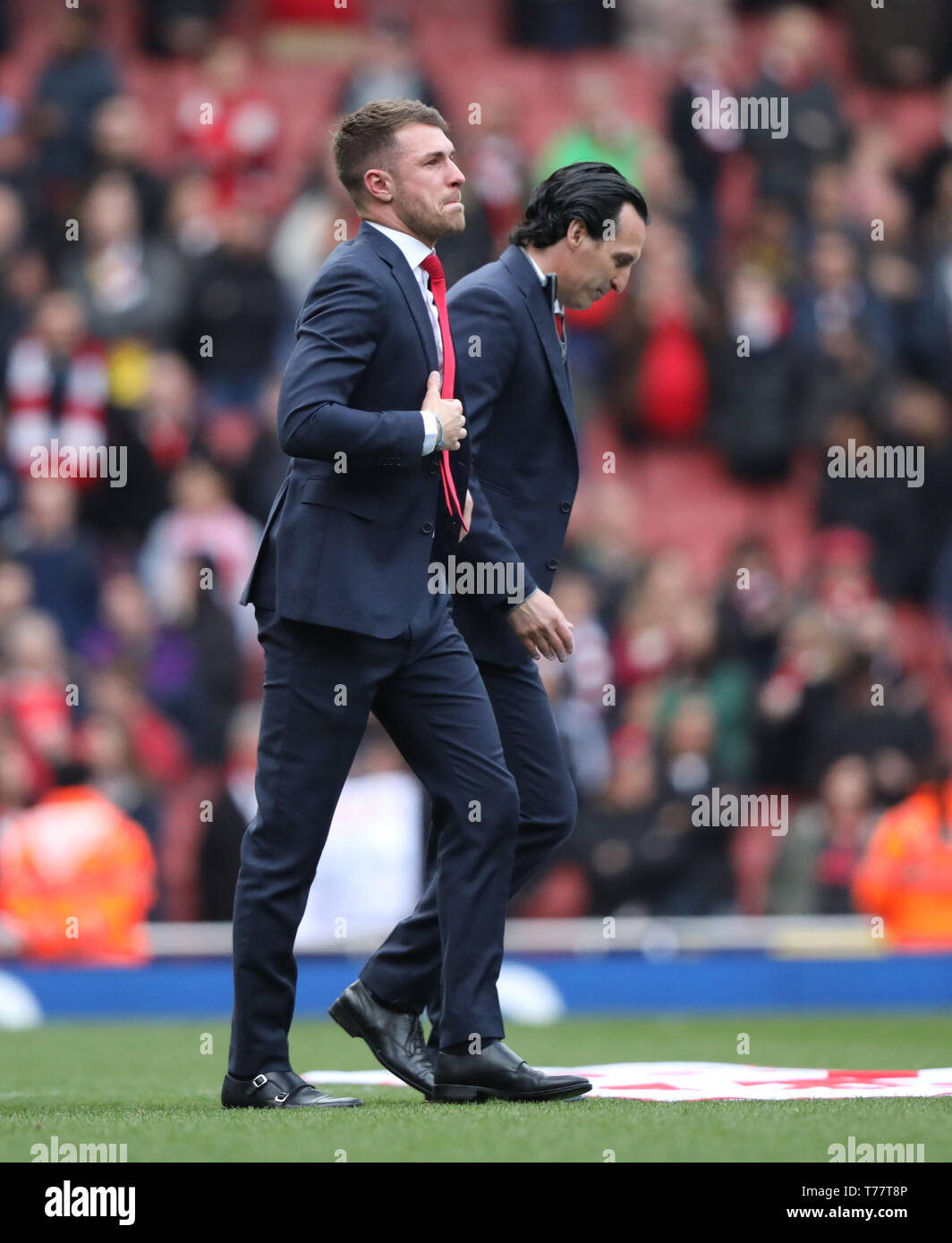 London, UK. 05th May, 2019. An emotional Aaron Ramsey (A) with Unai Emery (Arsenal manager), walks round to thank the fans, as he leaves Arsenal for Juventus at the end of the season, at the Arsenal v Brighton and Hove Albion English Premier League football match at The Emirates Stadium, London, UK on May 5, 2019. **Editorial use only, license required for commercial use. No use in betting, games or a single club/league/player publications** Credit: Paul Marriott/Alamy Live News Stock Photo