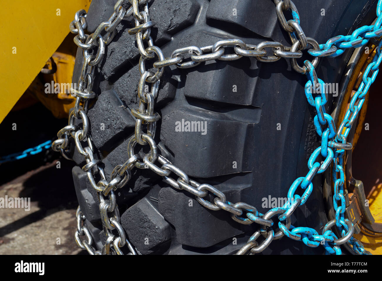 Tire chains for better traction in snow and ice travel on large