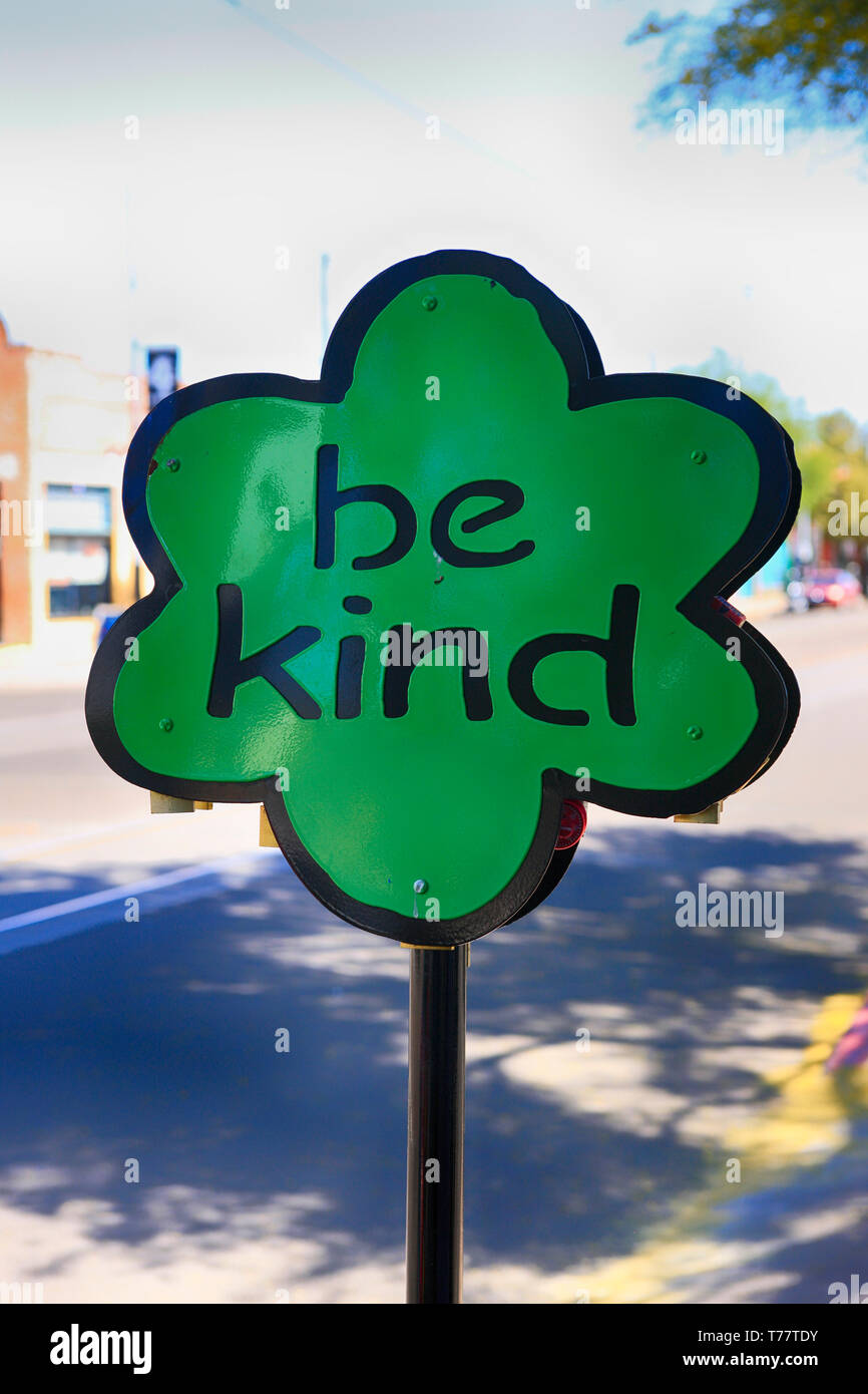 'Be Kind' metal flower art on 4th Ave in Tucson AZ Stock Photo
