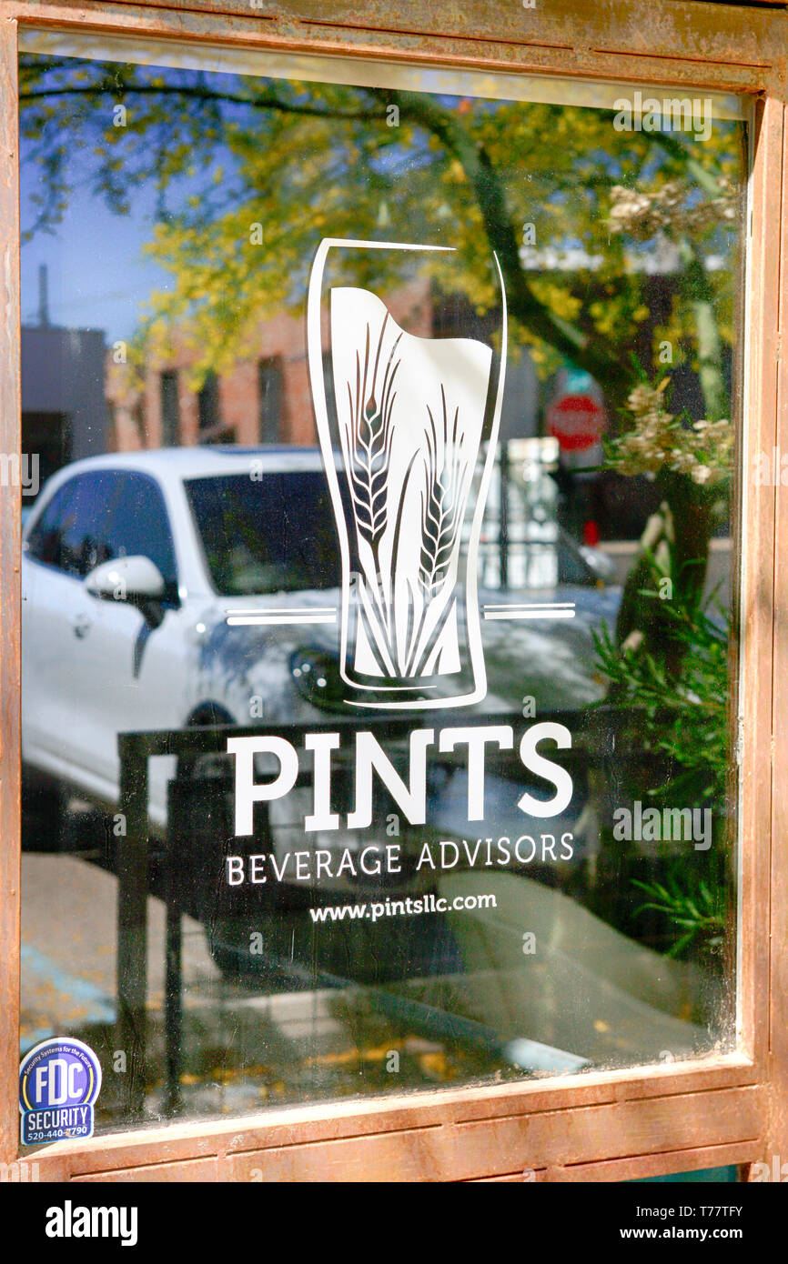 Glass door advertising for Pints Beverage Advisors. An Urban boutique business, part of the regeneration of N Downtown Tucson AZ Stock Photo