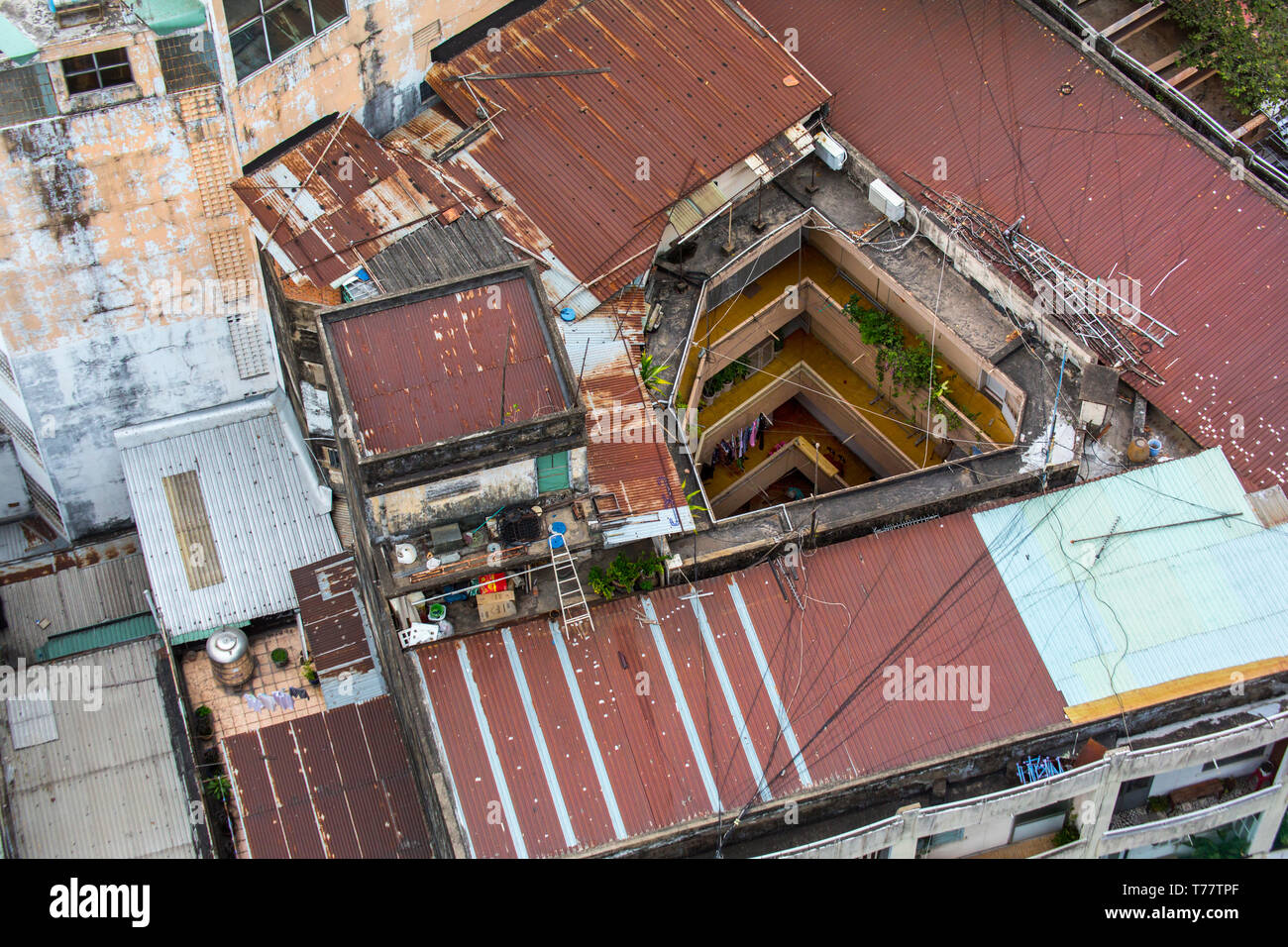 Old rusty roofs in Ho Chi Minh City, Vietnam. Stock Photo