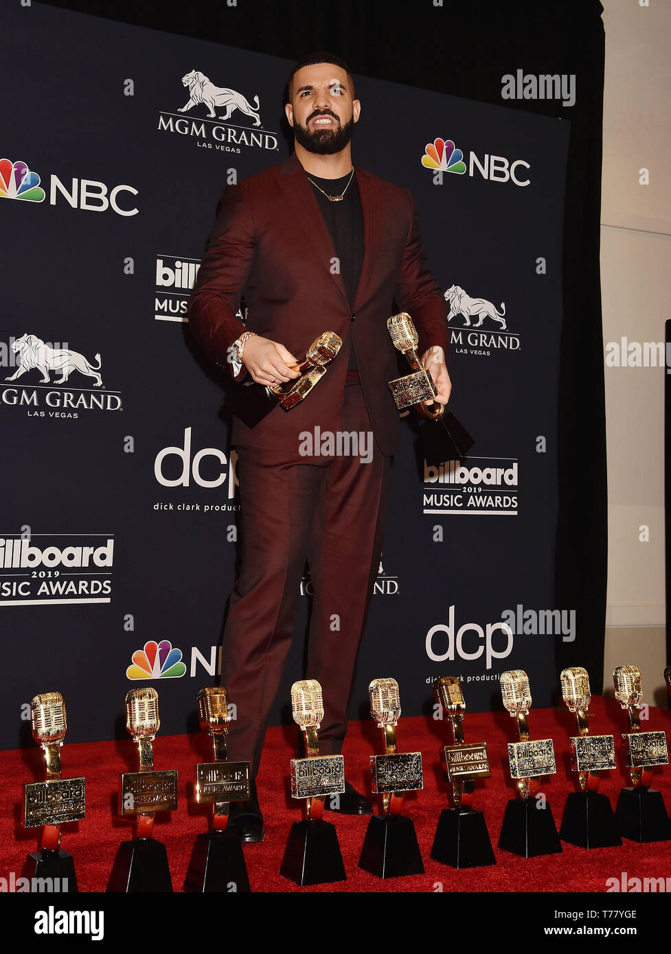 LAS VEGAS, NV - MAY 01: Drake poses with the awards for Top Artist, Top Male Artist, Top Billboard 200 Album for “Scorpion”, Top Billboard 200 Artist, Top Hot 100 Artist, Top Streaming Songs Artist, Top Song Sales Artist, Top Rap Artist, Top Rap Male Artist in the press room during the 2019 Billboard Music Awards at MGM Grand Garden Arena on May 01, 2019 in Las Vegas, Nevada. Stock Photo