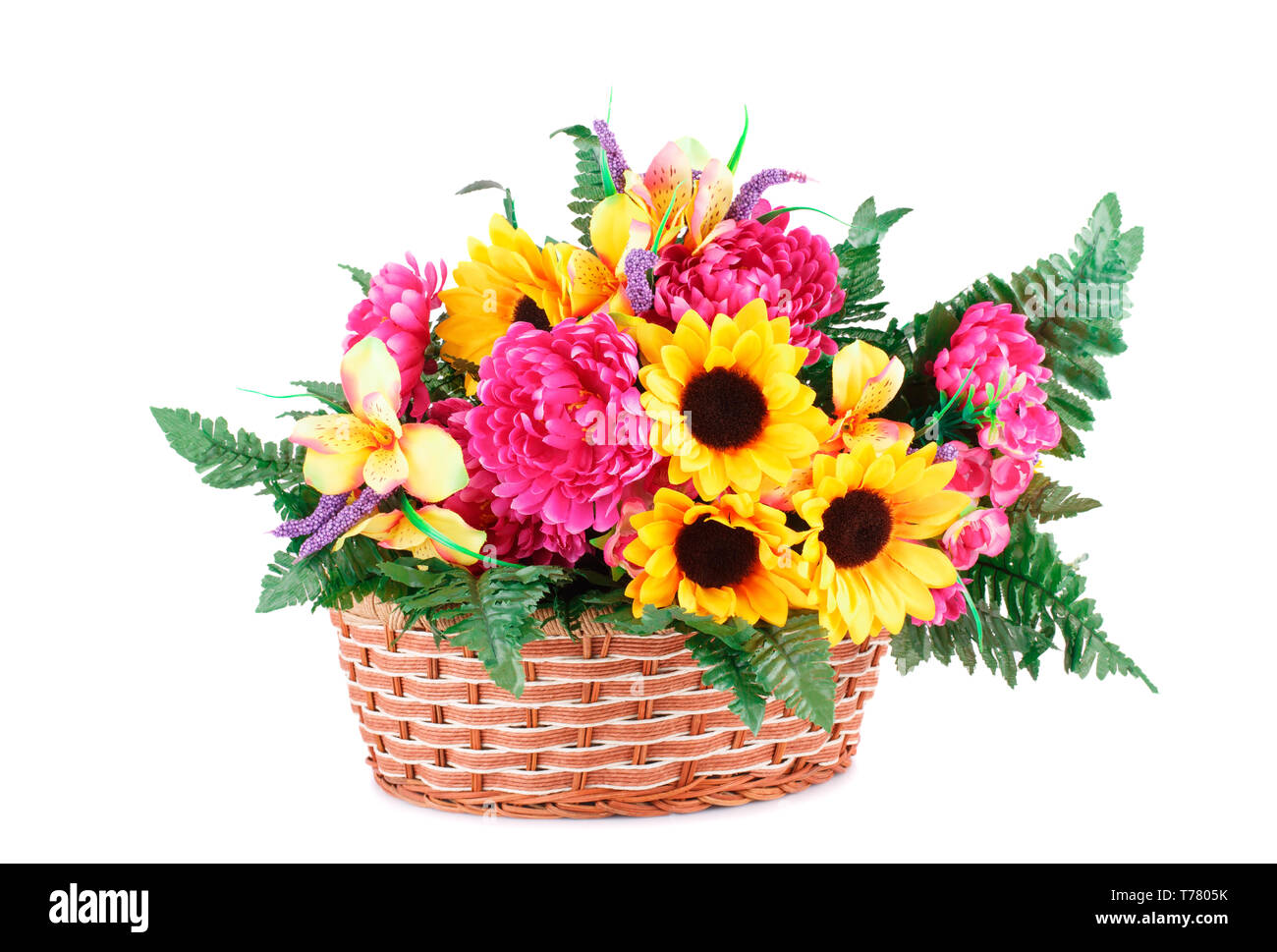 Colorful fabric flowers in wicker basket isolated on white background. Stock Photo