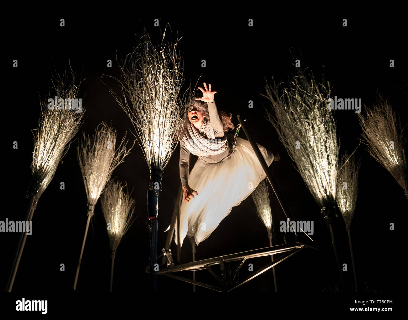 An artist performs during 'The Witching Hour', a large-scale immersive performance, by renowned theatre company Periplum, that explores stories of wise women, magical mythical characters and childhood memories, at East Park in Hull. Stock Photo