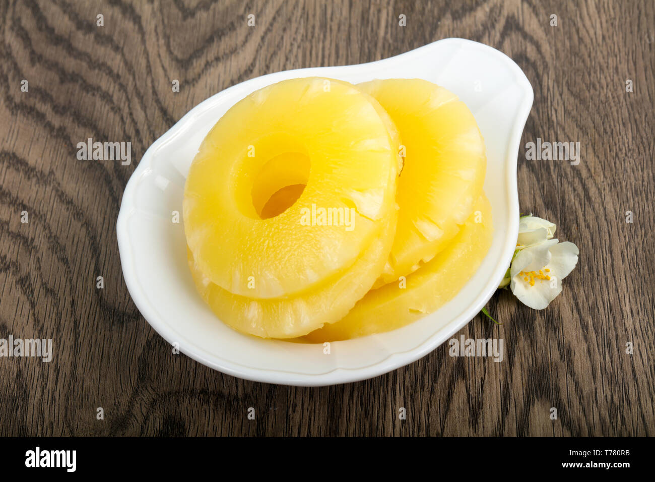 Canned pineapple rings in the bowl Stock Photo - Alamy
