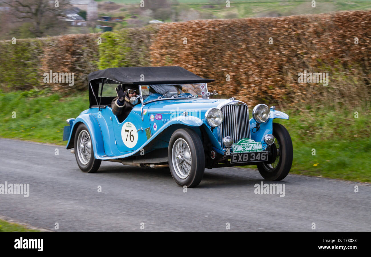 An AC March 16/18 Speciale climbs Southwaite Hill, Cumbria, England. The car is taking part in the 11th Flying Scotsman Rally, a free public-event. Stock Photo