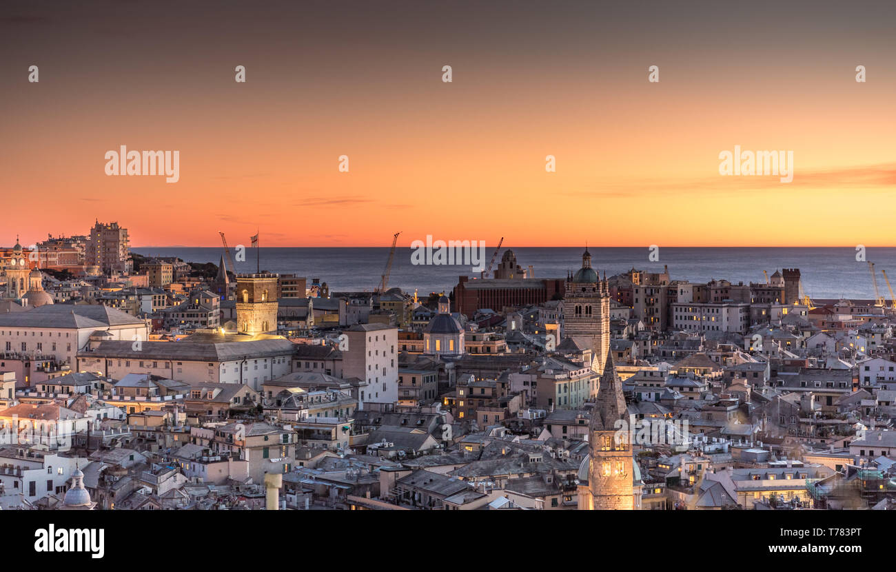 Genova, Italy: Beautiful sunset aerial panoramic view of Genoa historic centre old town (San Lorenzo Cathedral, duomo, Palazzo Ducale), sea and port Stock Photo