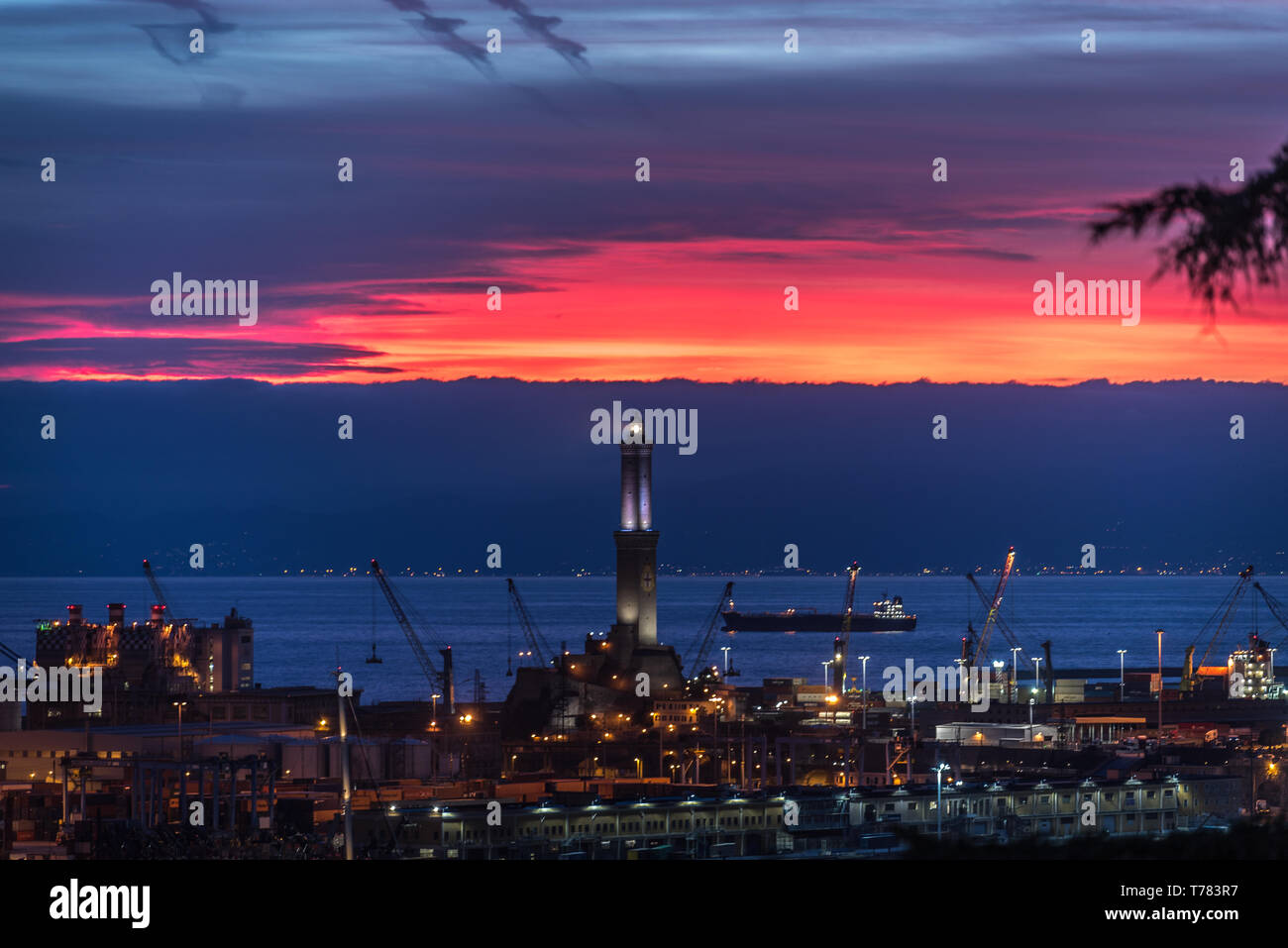 Genoa, Genova, Italy: Sunset aerial panoramic view of the Lanterna (lighthouse symbol of the city) and the port at dusk Stock Photo