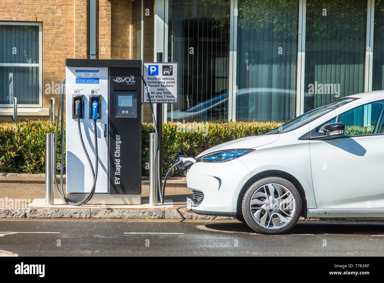 Electric car plugged into Evolt charge point in Cambridge, England, UK. Stock Photo