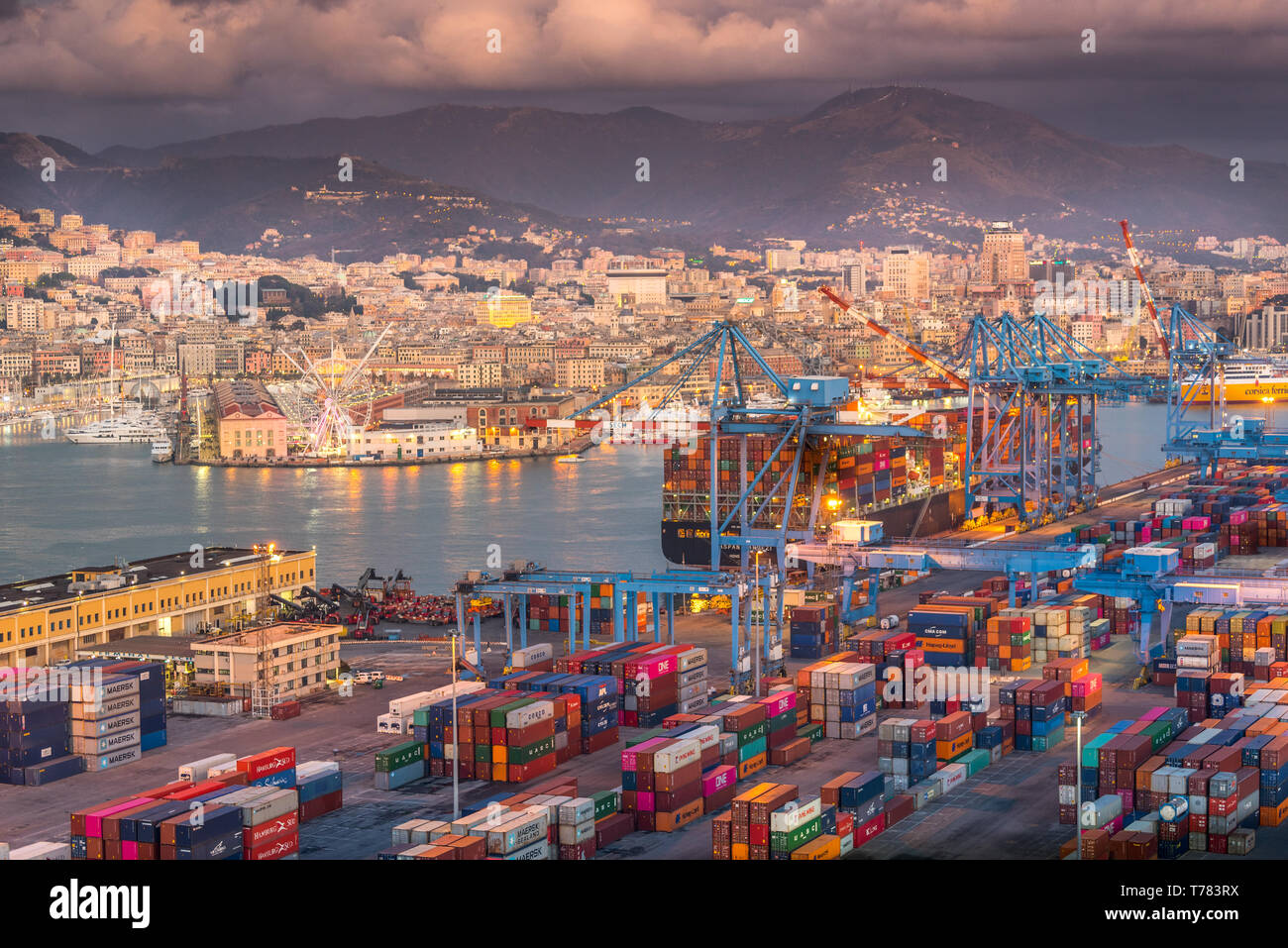 Genova, Genoa, Italy: Aerial view of shipping and container terminal, stacked containers and loading dock side cranes in the port of Genoa Stock Photo