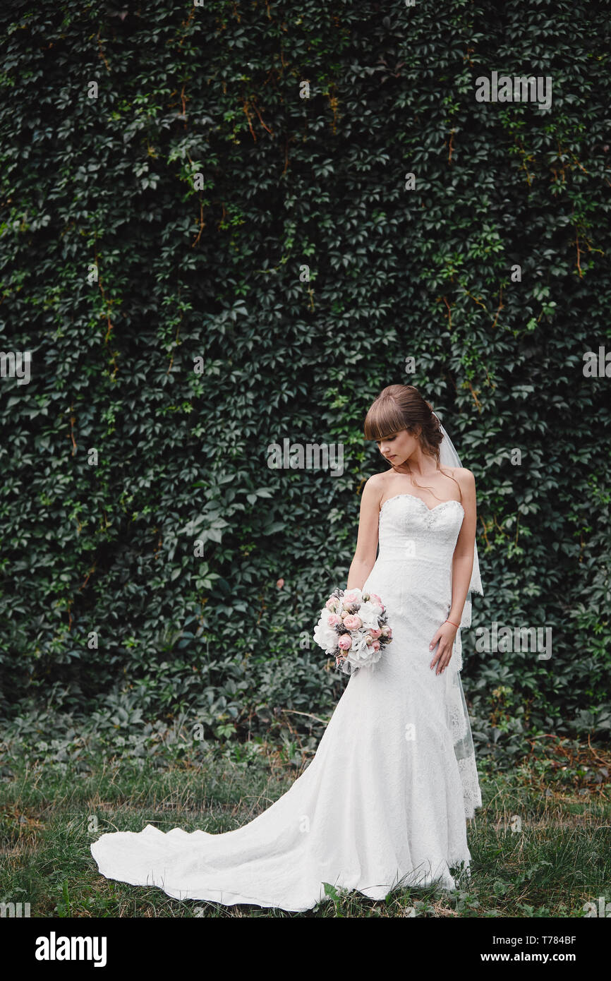 A Beautiful Bride Portrait Beautiful Bride In Fashion Wedding Dress On Natural Background The Stunning Young Bride Is Incredibly Happy Wedding Day Stock Photo Alamy