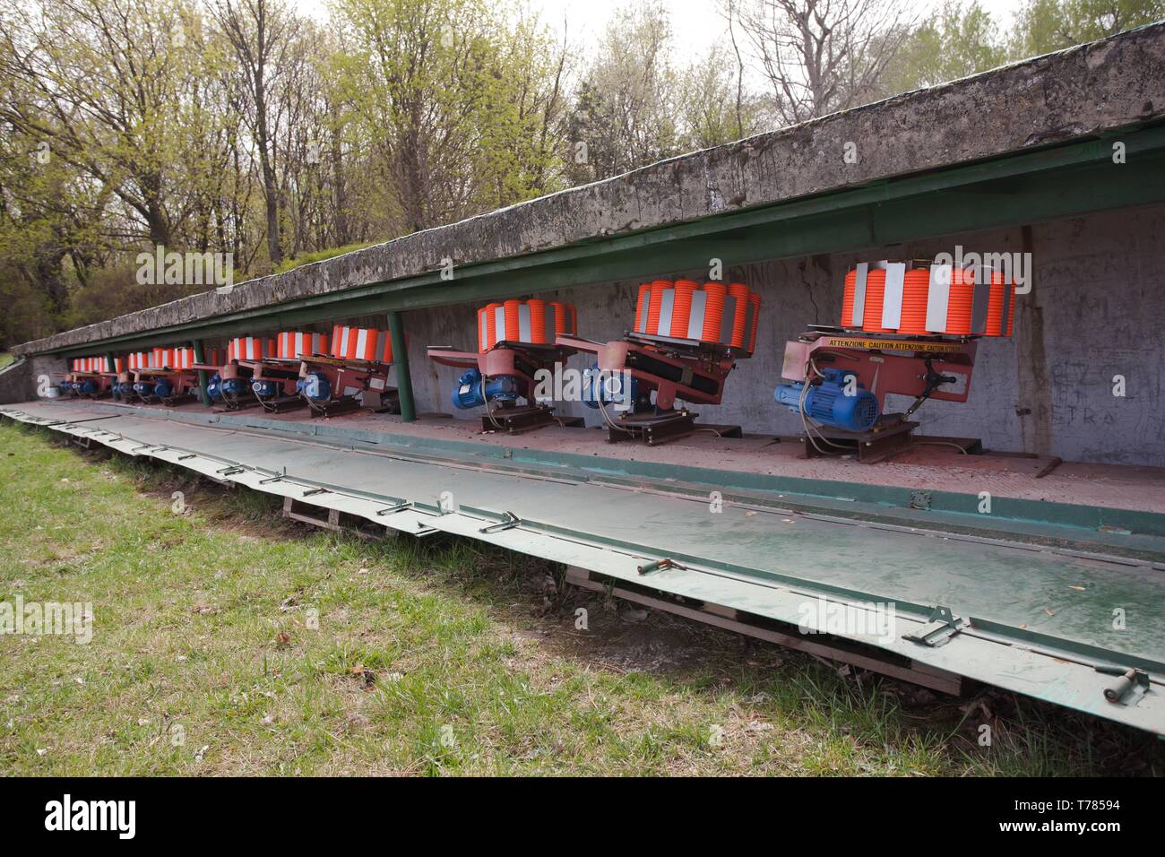 Shooting range equipment for flying targets - orange pigeons - 12 of 15 units for trap shooting Stock Photo