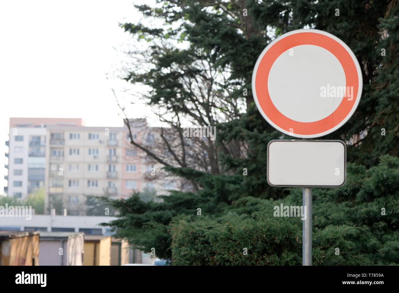 Conceptual All Vehicles Prohibited Sign - with blank supplementary board - block of flats in background Stock Photo