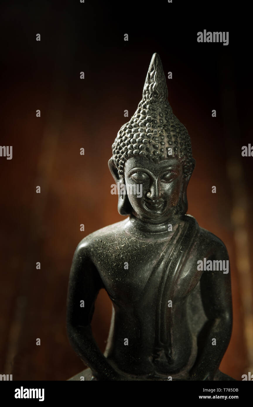 Still life black Buddha statue,religion concept Stock Photo - Alamy
