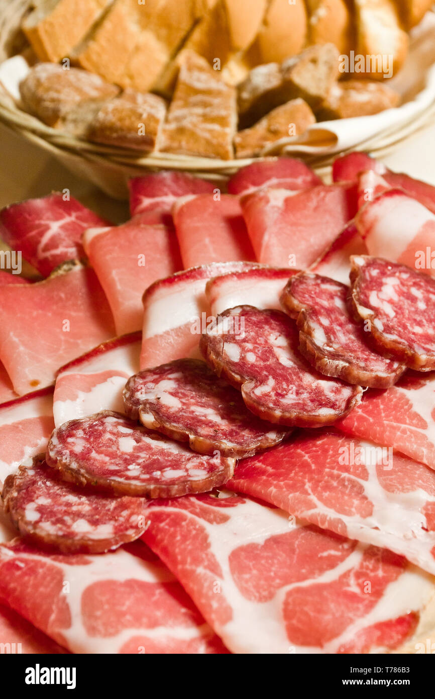 Salumi tipici valtellinesi:speck, salame, bresaola, ecc.  [ENG]  Valtellina typical cold cuts: smoked ham, salami, bresaola, etc Stock Photo