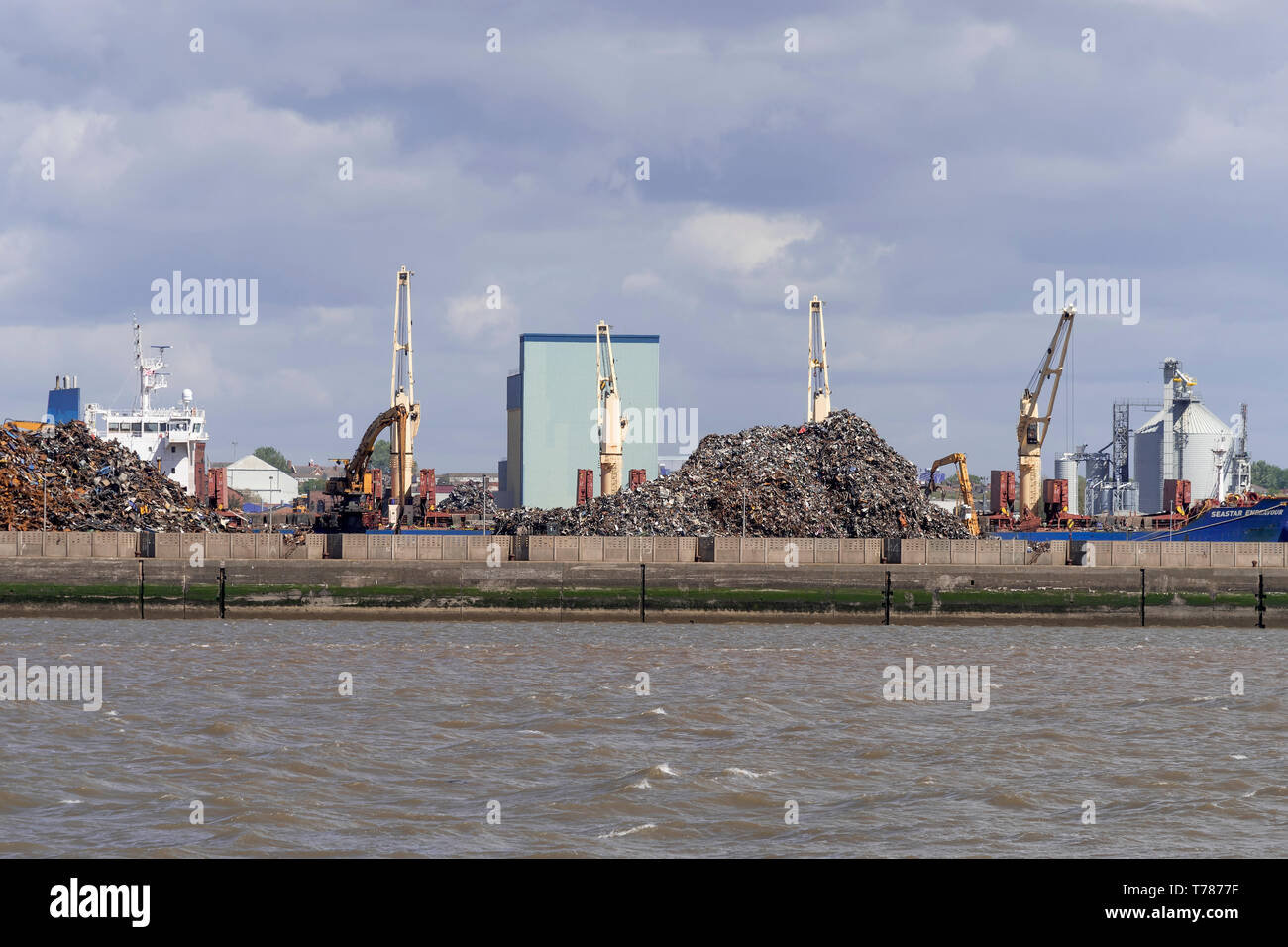 Liverpool.docks  Giant cranes. Scrap metal heap. Stock Photo