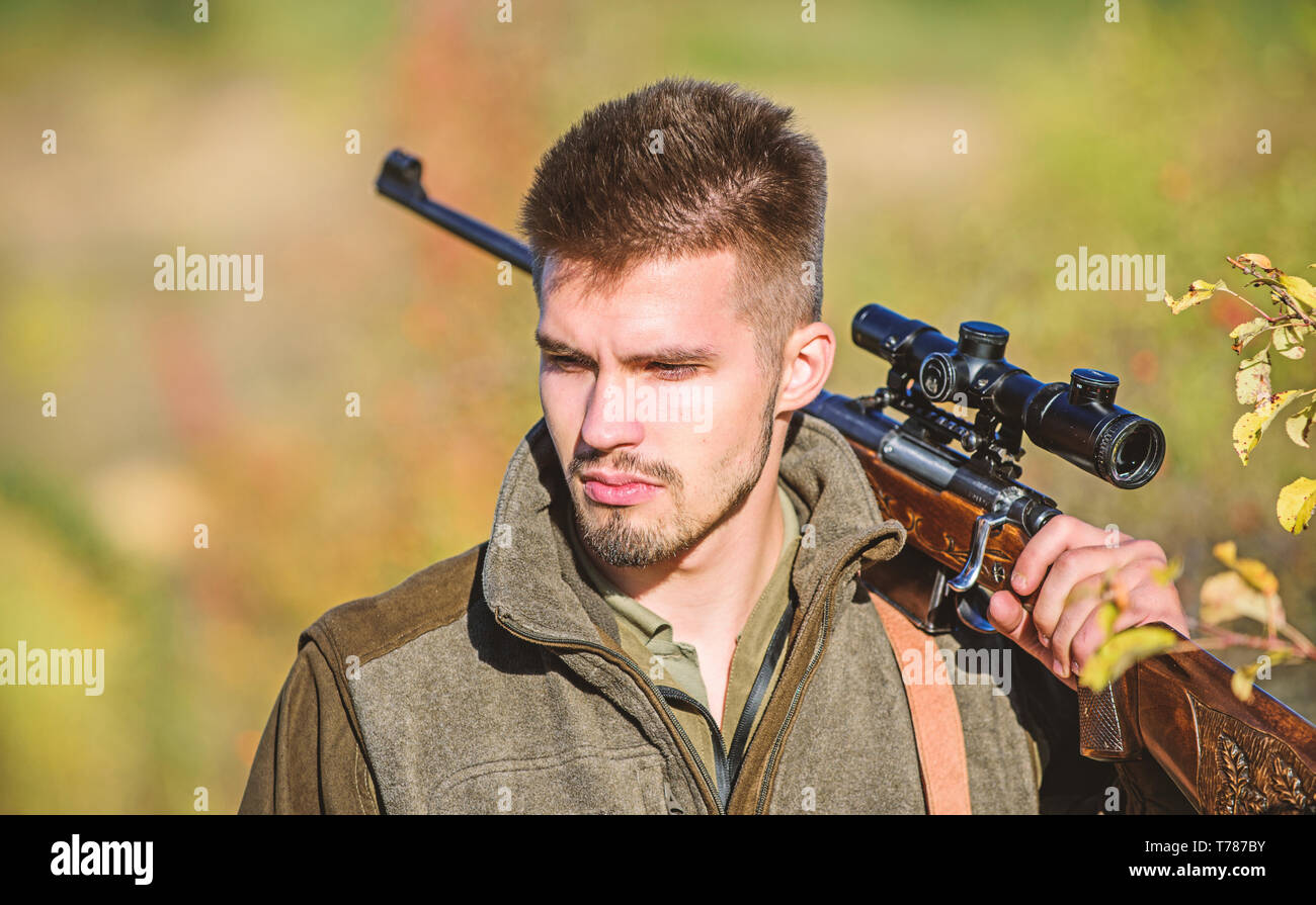Army forces. Camouflage. Bearded man hunter. Hunting skills and weapon equipment. How turn hunting into hobby. Military uniform fashion. Man hunter with rifle gun. Boot camp. Total concentration. Stock Photo