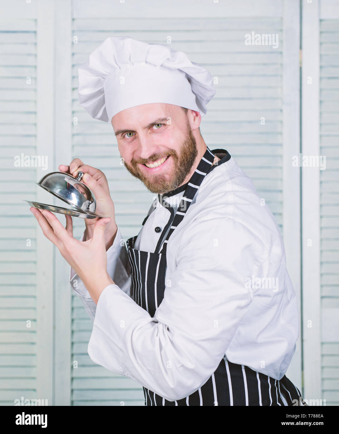 https://c8.alamy.com/comp/T788EA/special-offer-from-chef-dish-of-the-day-chef-ready-for-cooking-confident-man-in-apron-and-hat-hold-tray-professional-in-kitchen-culinary-cuisine-bearded-man-love-food-cook-in-restaurant-T788EA.jpg