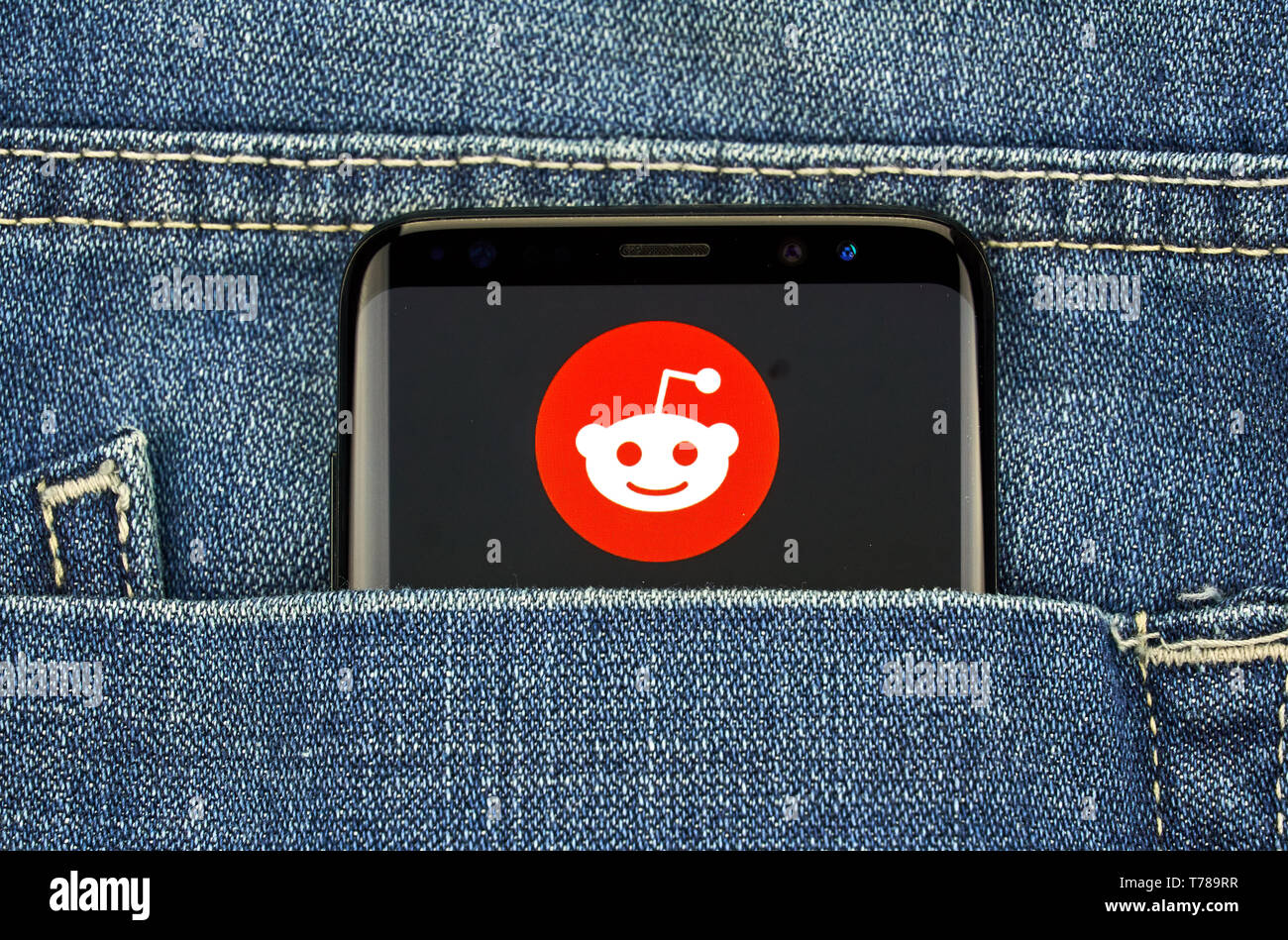 MONTREAL, CANADA - December 23, 2018: Reddit logo and android app on Samsung s8 screen in a blue jeans pocket. Reddit is an American social news aggre Stock Photo