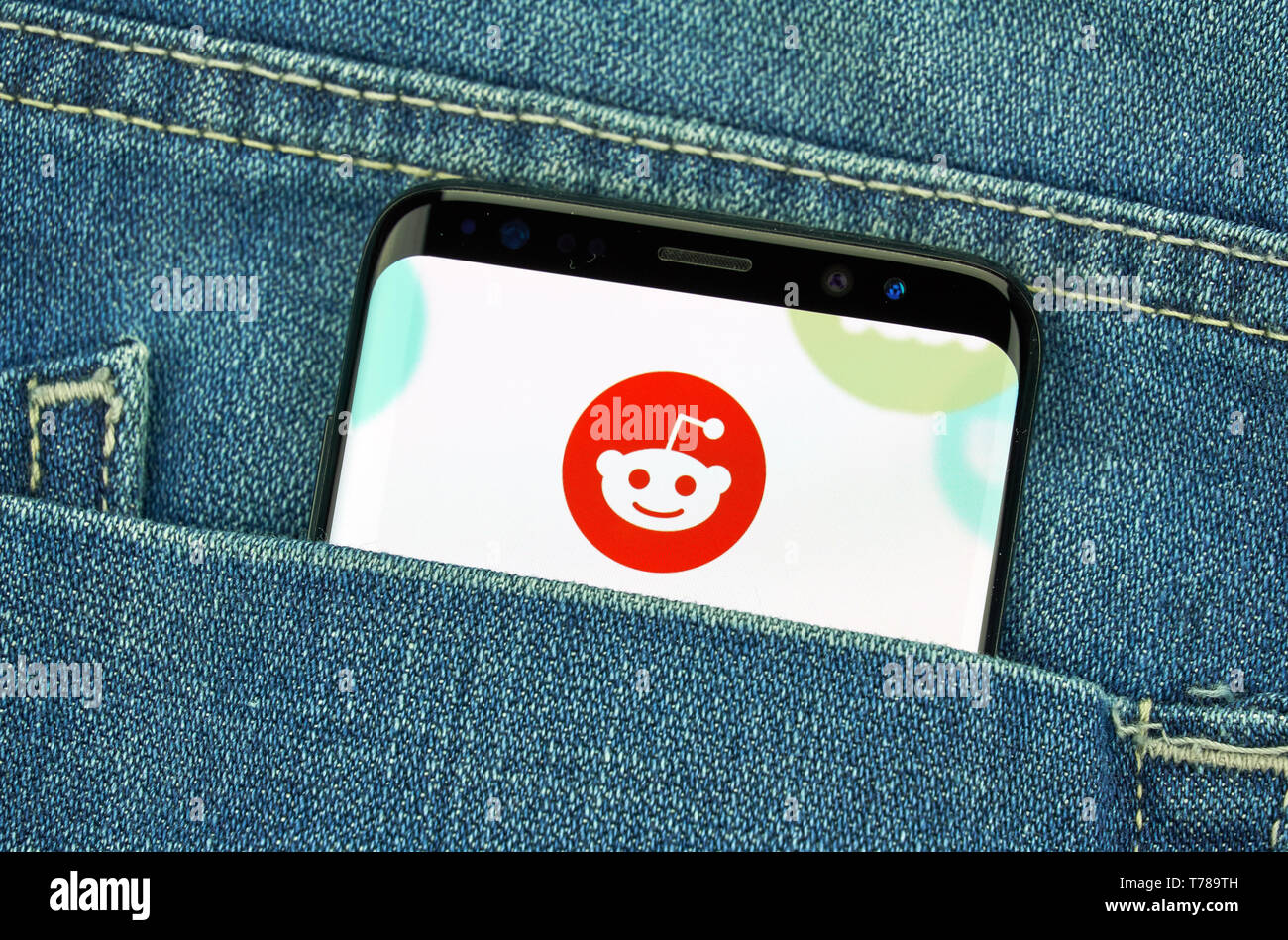 MONTREAL, CANADA - December 23, 2018: Reddit logo and android app on Samsung s8 screen in a blue jeans pocket. Reddit is an American social news aggre Stock Photo