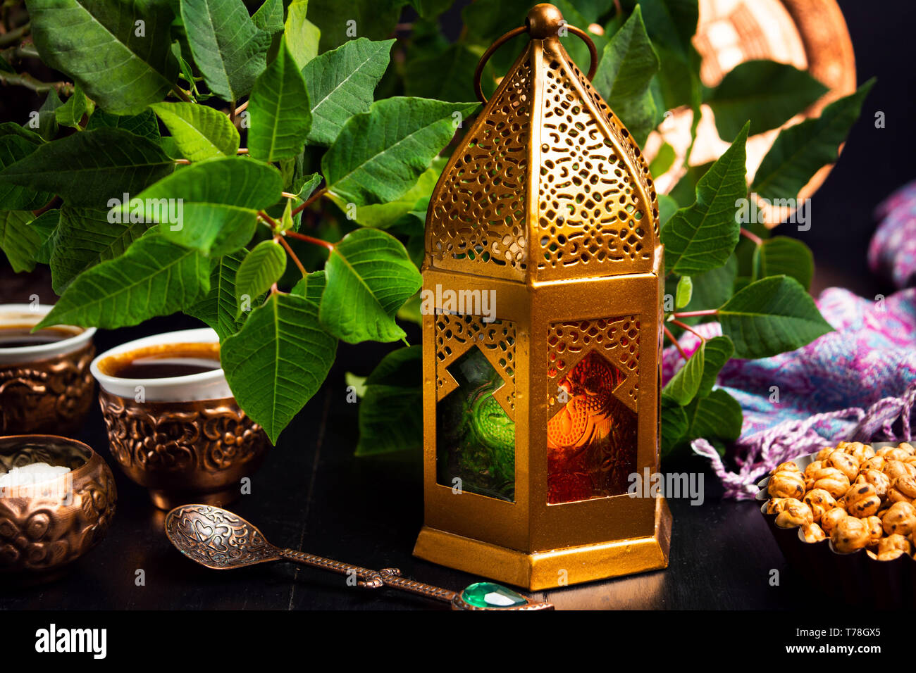 Dates served with coffee in Arabic style arrangement on a table Stock Photo