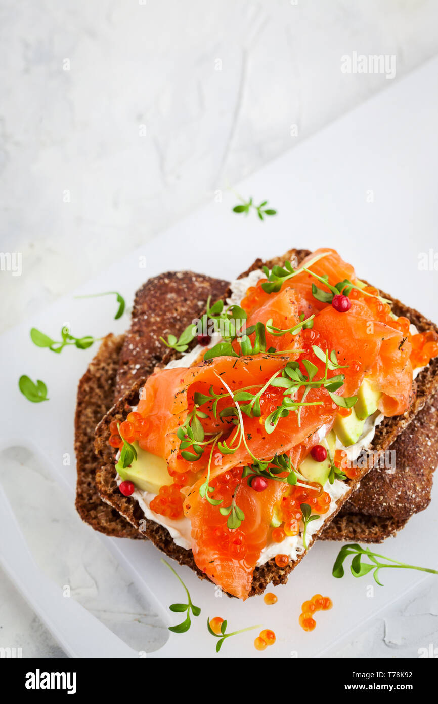 Salted salmon, red caviar, avocado and cream cheese rye crisp toast