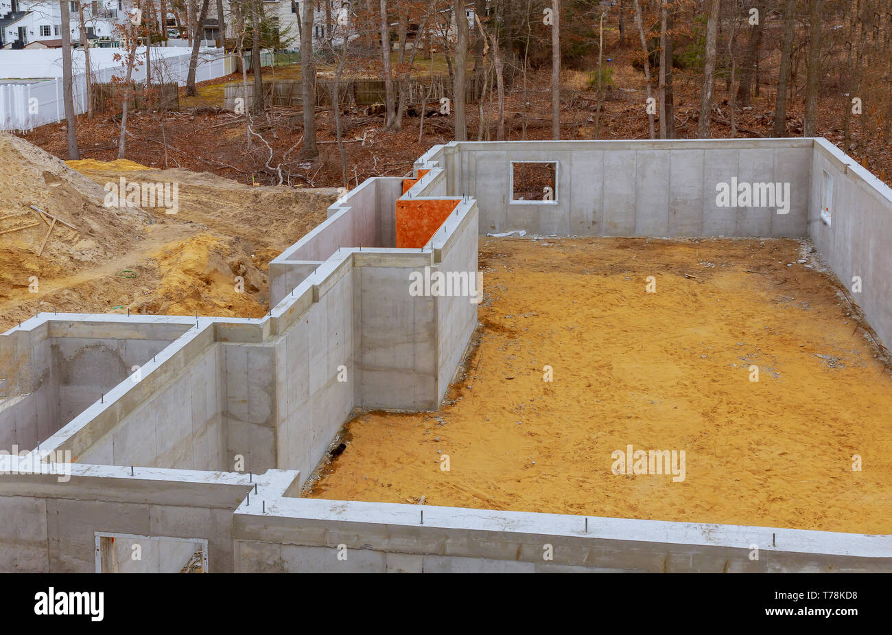 Under construction foundation new home with cement basement foundation