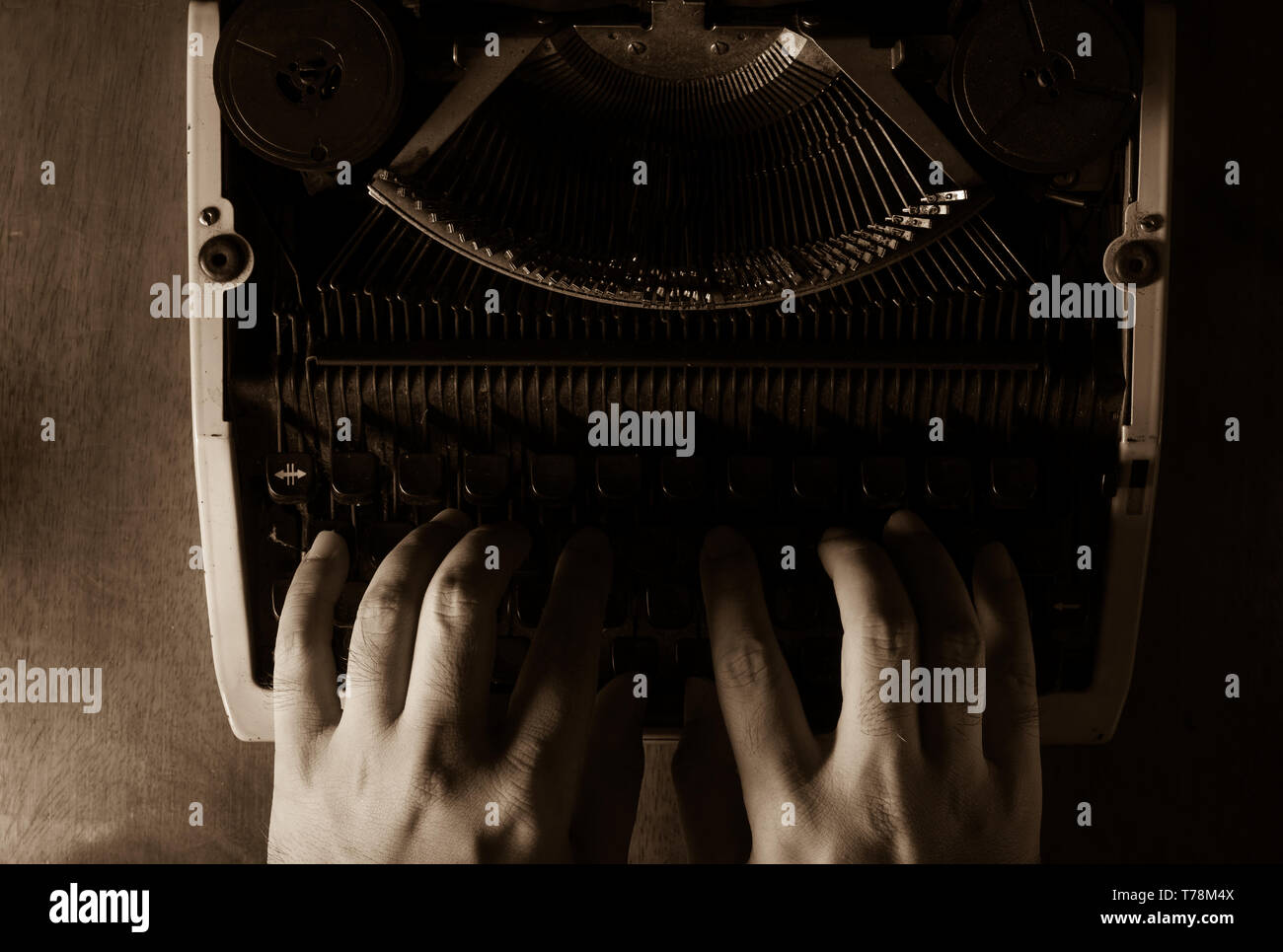 Human hands typing with typewriter,black and white color. Stock Photo