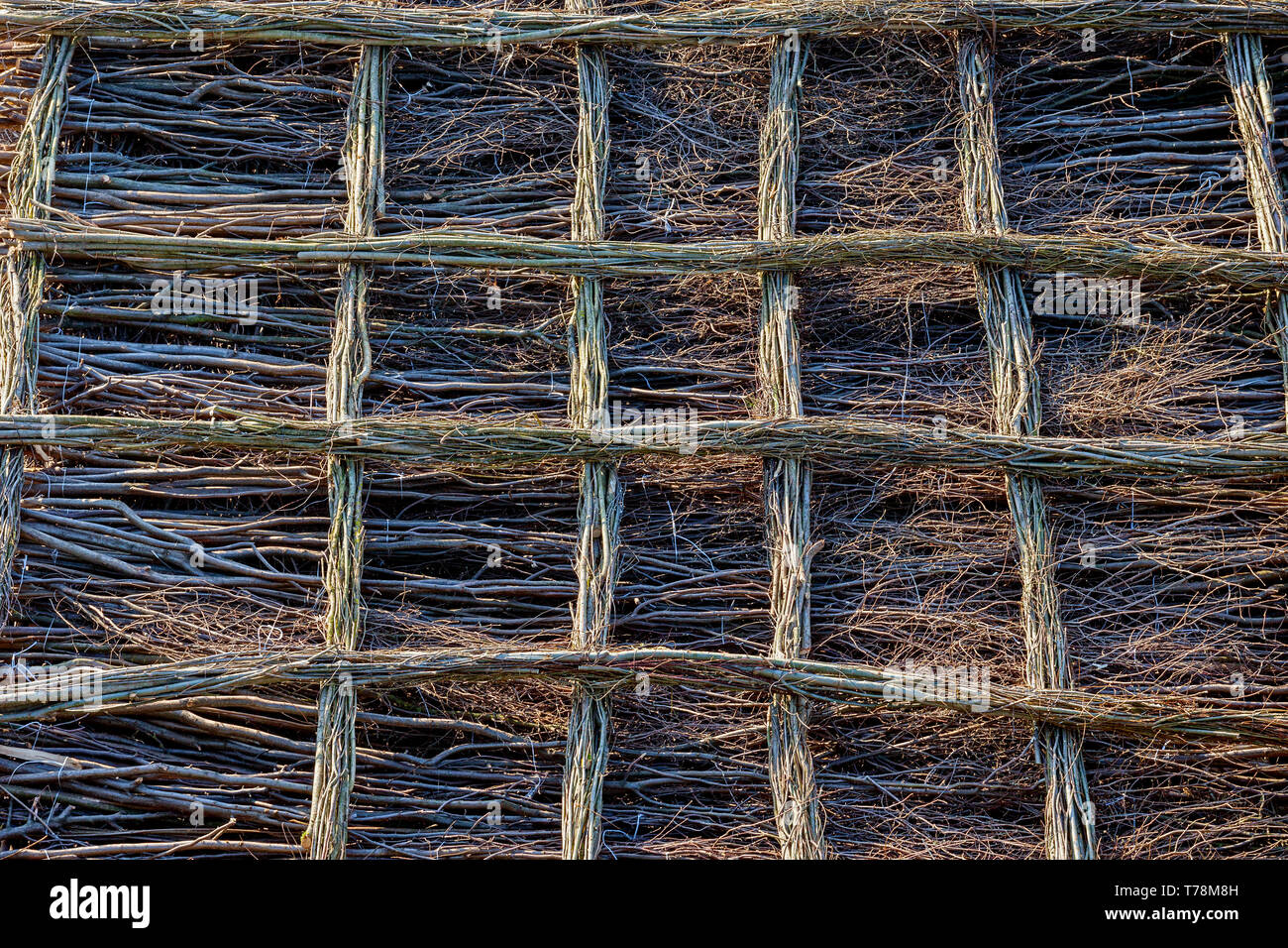 Abstract pattern background, natural floor made from tree branches with lattice grating Stock Photo