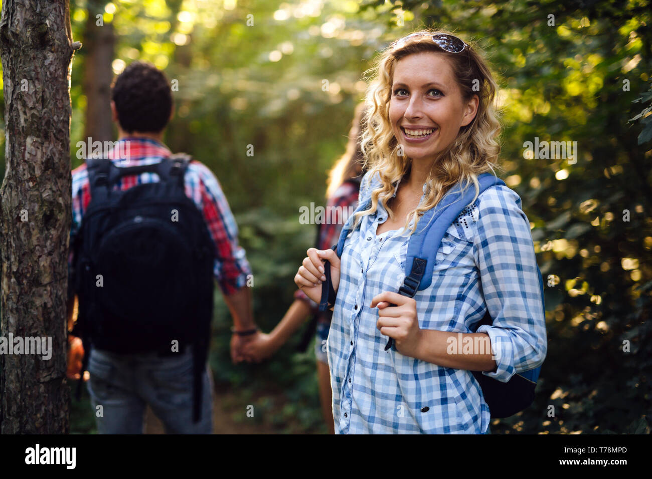 Group of backpacking hikers going for forest trekking Stock Photo Alamy