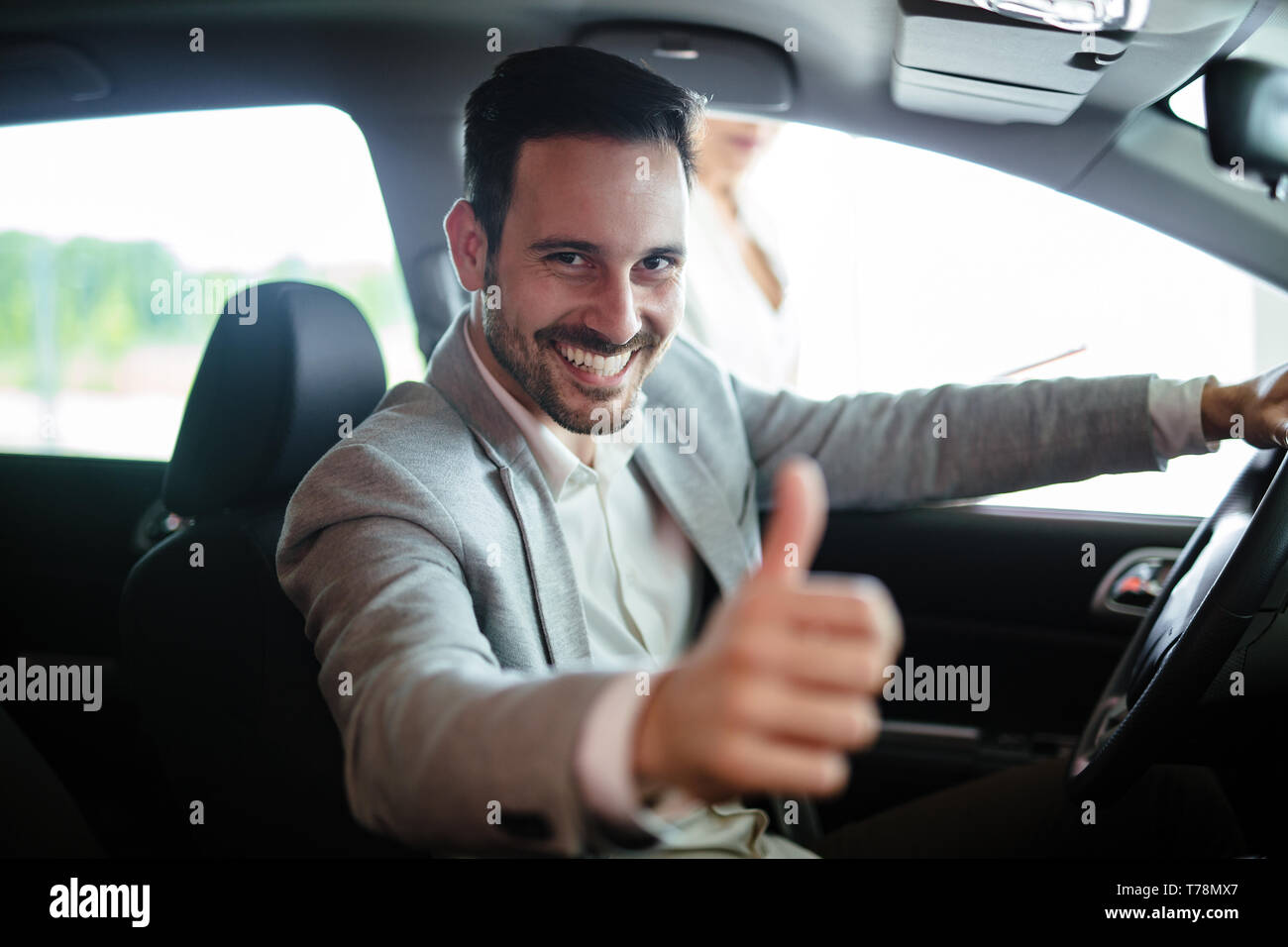 Portrait of happy customer buying new car Stock Photo