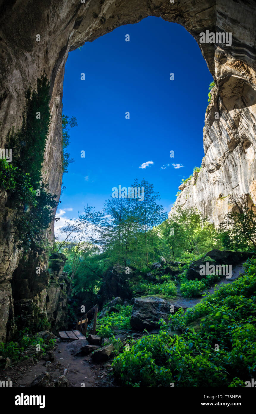 Prohodna Prohodna cave, Bulgaria. It is nown as God's eyes. Located near ...