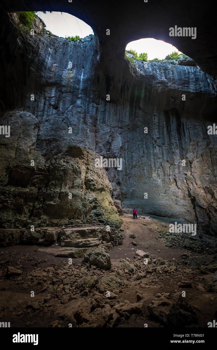 Prohodna Prohodna cave, Bulgaria. It is nown as God's eyes. Located near ...