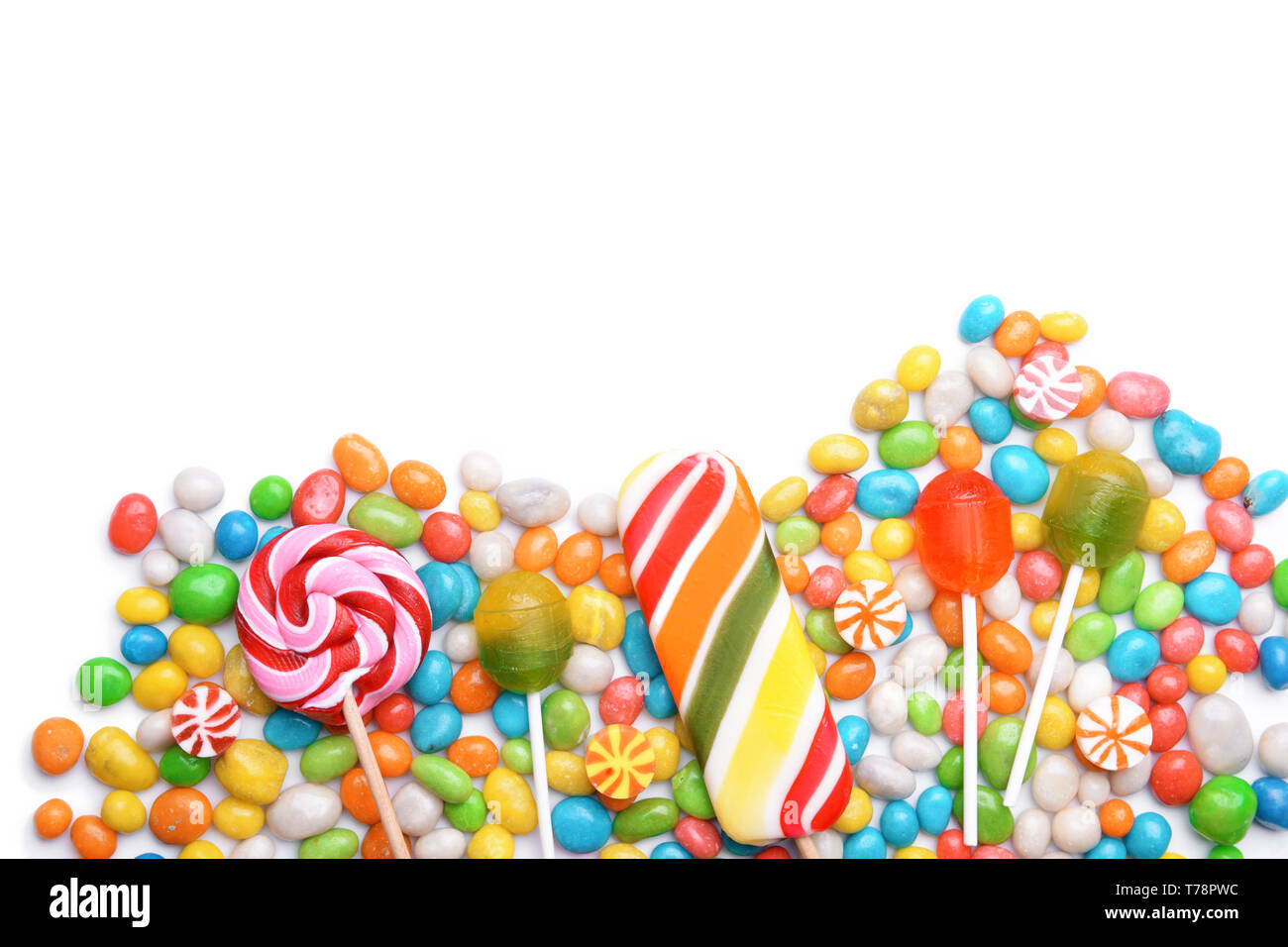 Tasty lollipops and colorful candies on white background Stock Photo ...
