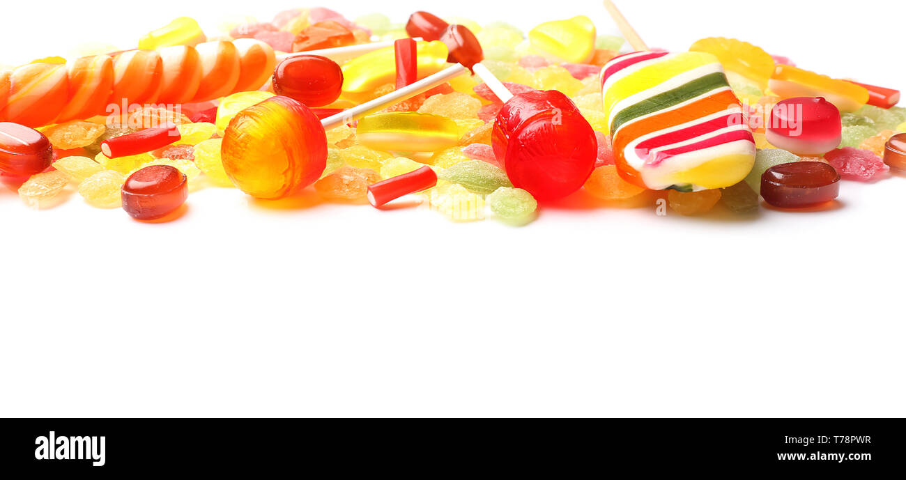 Tasty lollipops and colorful candies on white background Stock Photo ...