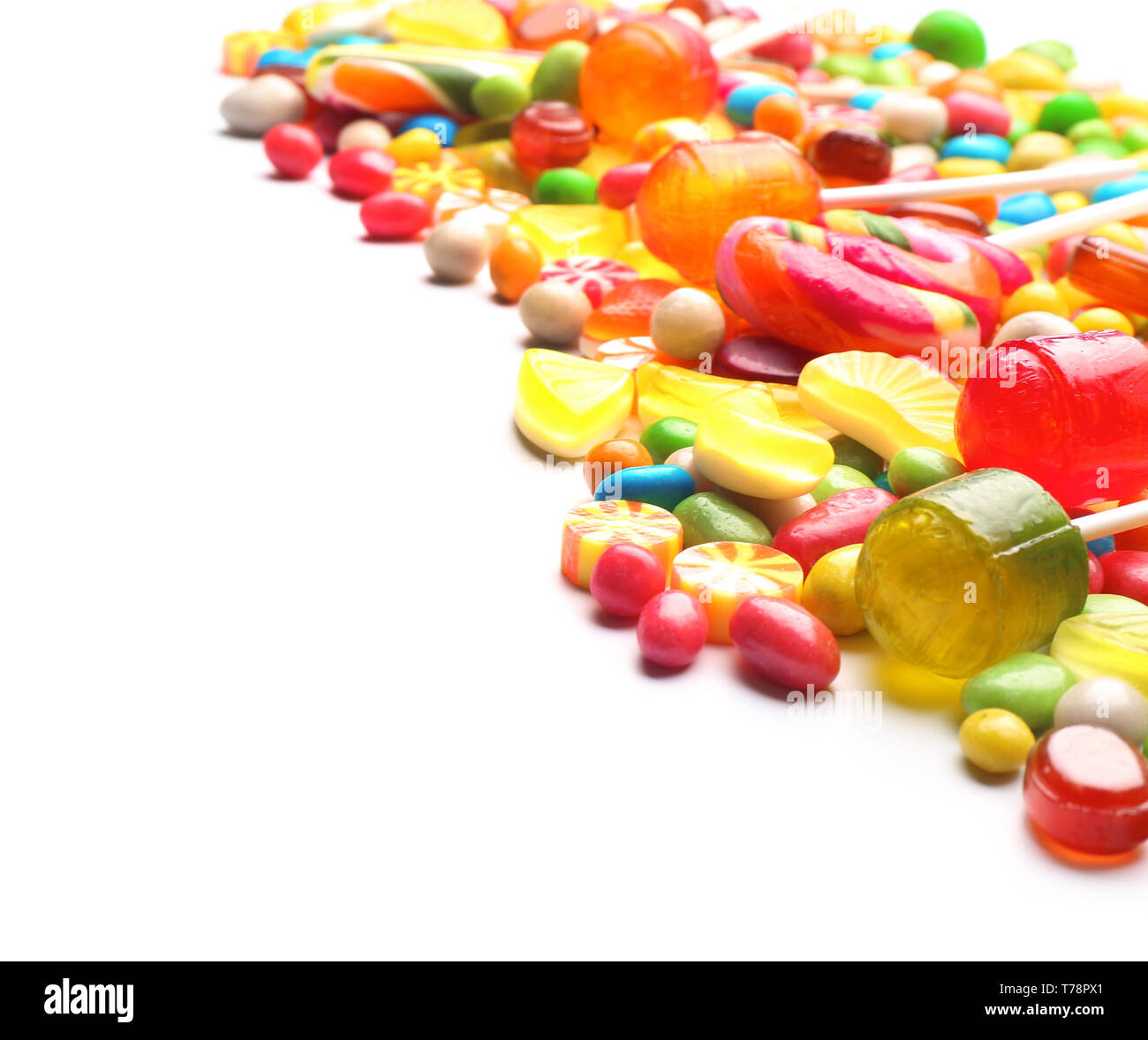 Tasty lollipops and colorful candies on white background Stock Photo ...